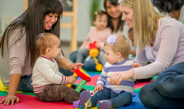 Two early childhood education and care educators