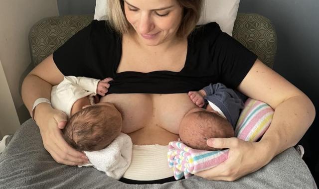 Mother breastfeeding twins