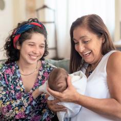 A woman with her baby and her mother
