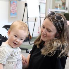 A woman and her baby indoors