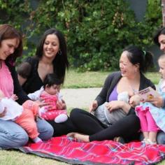 women and children on picnic rug