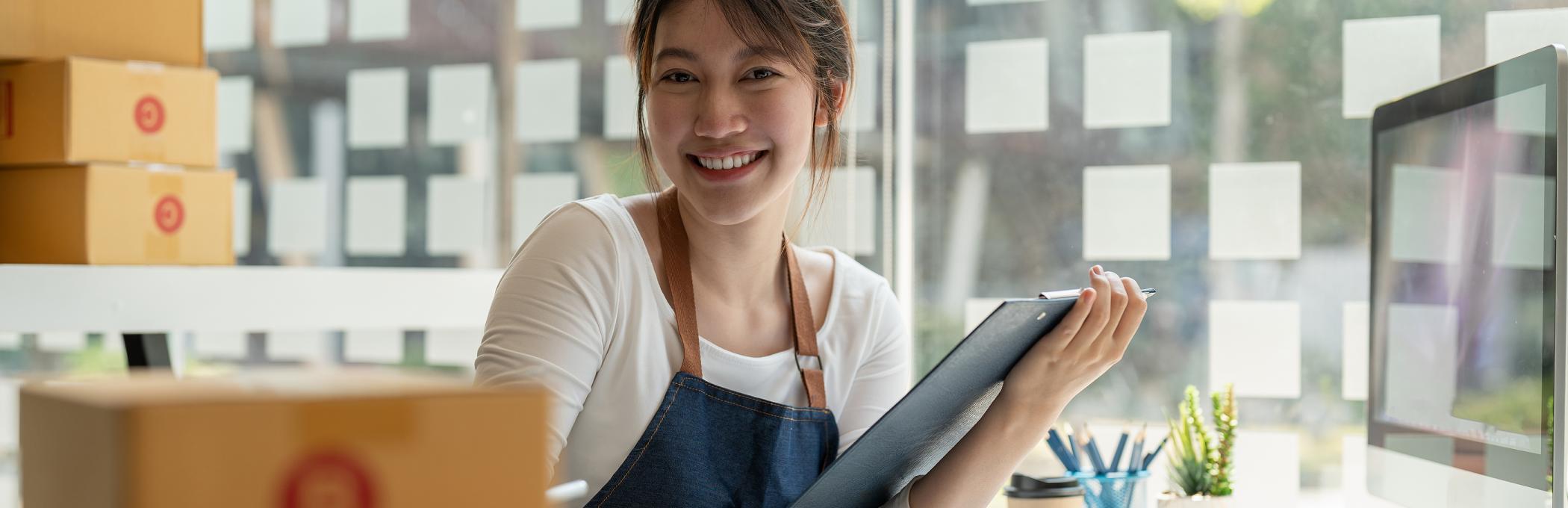 Sales women with boxes on a desk